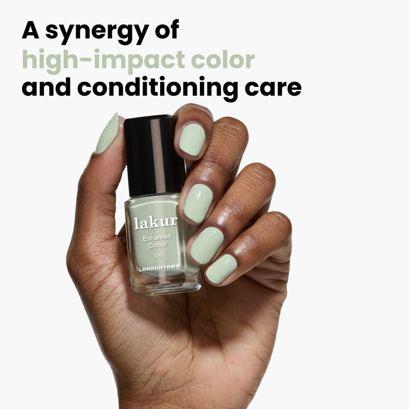 A hand holds a LONDONTOWN bottle of pale green "Lichen" nail polish, infused with white sage, promising "A synergy of high-impact color and conditioning care," with nails painted in the same calming shade.