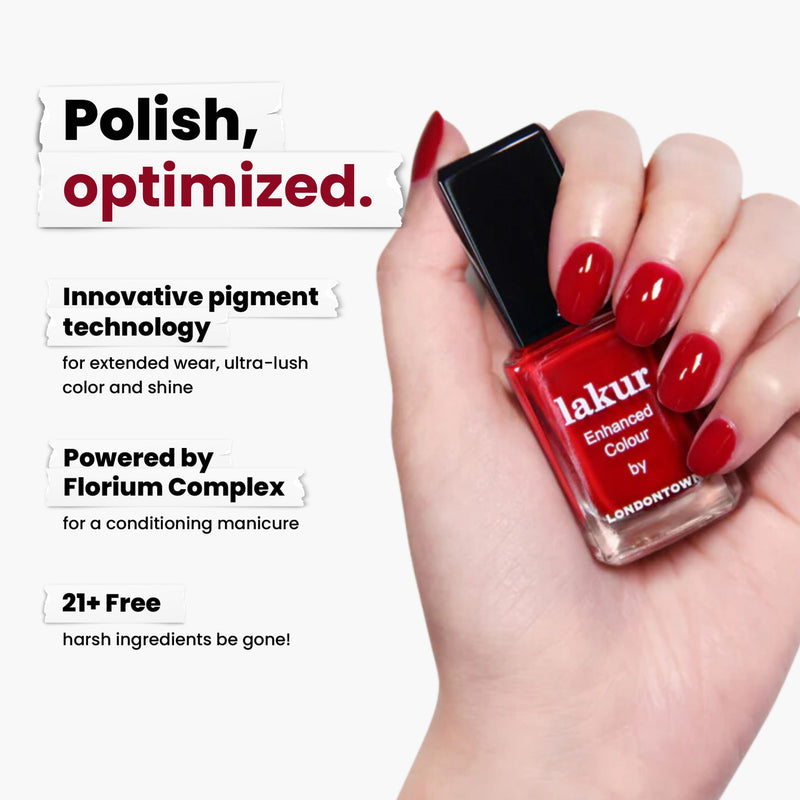 A hand holds a bottle of Ring Me by LONDONTOWN, a red crème lakur nail polish. This vegan, cruelty-free polish features innovative pigment technology and Florium Complex, is free from 21+ harsh ingredients, and offers a vibrant finish without compromise.