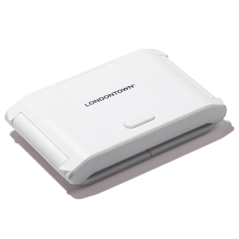 The LONDONTOWN Foldable UV/LED Gel Lamp is a white, rectangular device with rounded edges and a central button—designed for travel-friendly, fast gel curing.