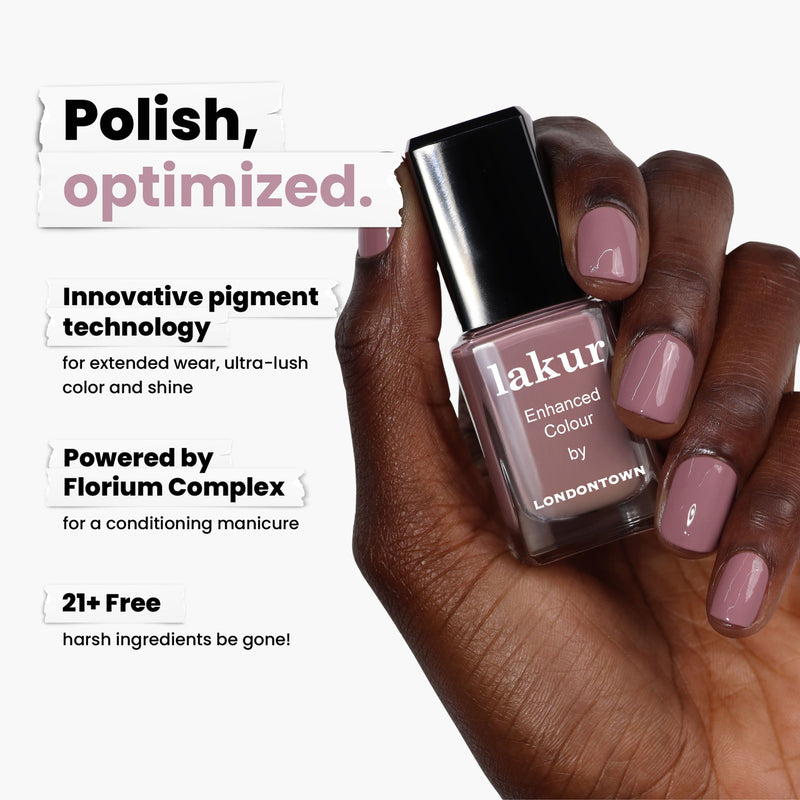 A hand cradles LONDONTOWN's Bell Flower nail polish in romantic dusty pink. With innovative pigment technology, extended wear, and nurturing Florium Complex, it's 21+ free of harsh ingredients—bringing a fairytale touch to your nails.