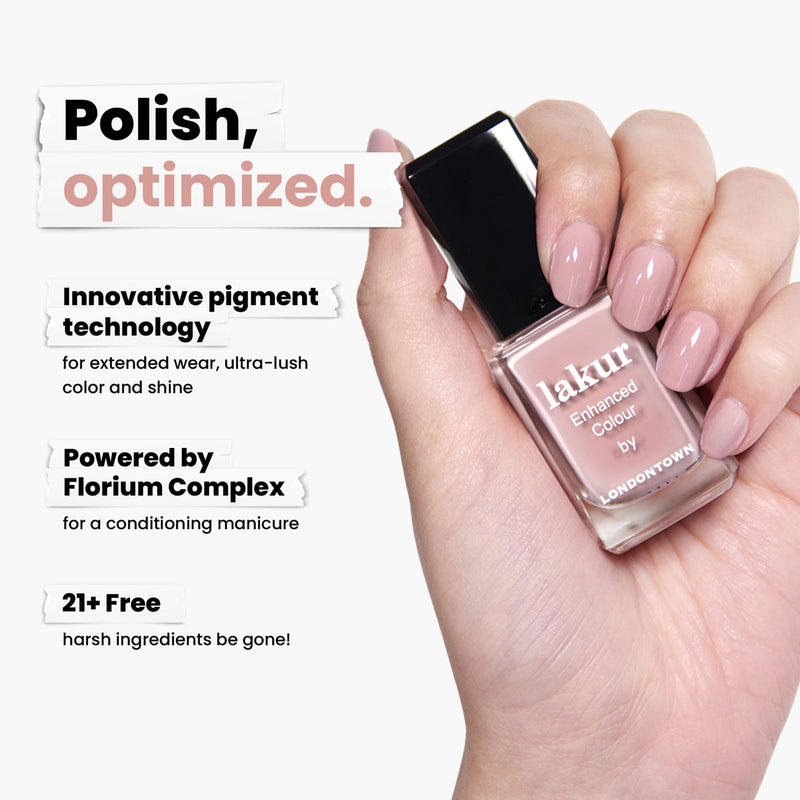 A hand displays a bottle of Honeymoon pink nail polish by LONDONTOWN, featuring innovative pigment technology and the Florium Complex. It's vegan, cruelty-free, and free from 21+ harsh ingredients, setting new beauty standards in safety and style.
