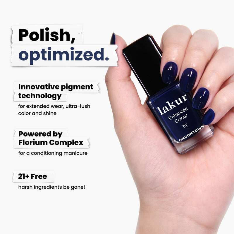 A hand holds LONDONTOWN's Buckingham Blue nail polish, showcasing innovative pigment technology and Florium Complex for conditioning. It's proudly vegan, cruelty-free, and formulated without 21+ harsh ingredients.
