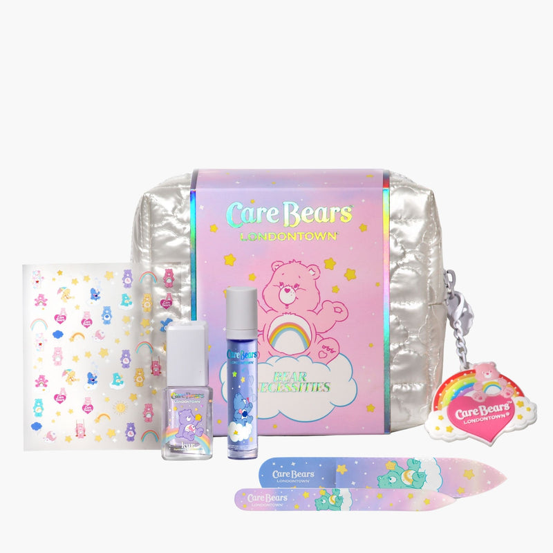 The Bear Necessities Set by LONDONTOWN includes nail polish, lip gloss, stickers, a nail file, rainbow keychain, and silver pouch—all in a pastel box for the perfect Care Bears-inspired beauty experience.
