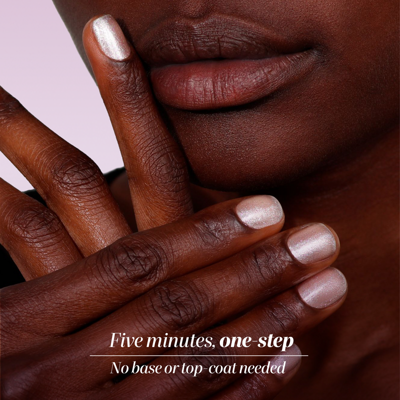Close-up of a person with dark skin wearing LONDONTOWN's Shimmering Nail Highlighter in Mirror Ball. Metallic nude finish. Five minutes, one-step application—no base or top coat needed.