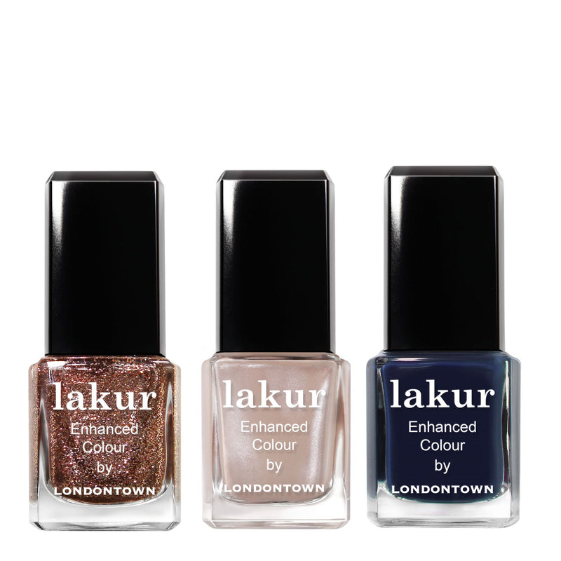 The LONDONTOWN Moonlit Botanica Mini lakur trio features three mini nail polishes in rose gold glitter, light nude, and dark navy shades, arranged side by side on a white background.