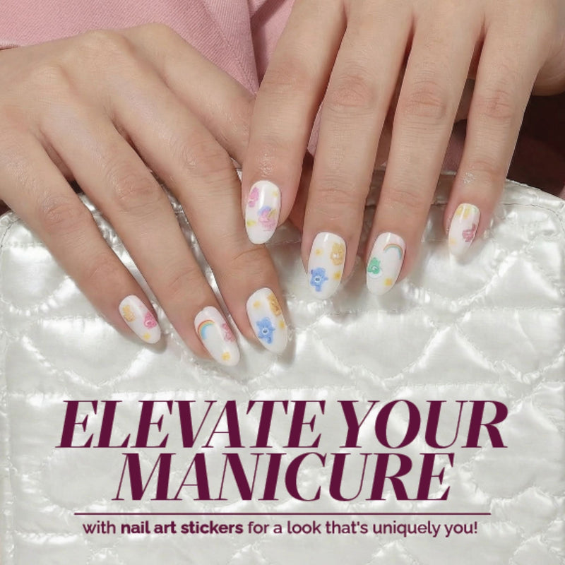 Hands with Care Bears Nail Decals by LONDONTOWN resting on a white quilted surface. Text reads: "Customize your manicure easily with LONDONTOWN Care Bears Nail Decals—create playful nail art in minutes!.