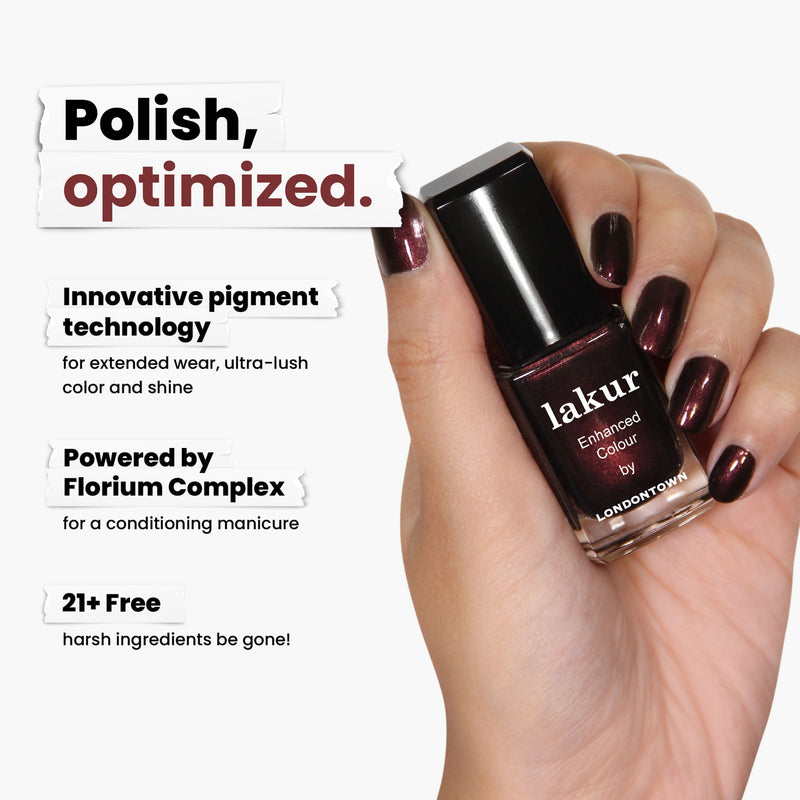 A hand holds a bottle of LONDONTOWN's "Cockney Glam," a luxurious red-toned metallic crème. Its innovative pigment technology and Florium Complex offer a vegan, cruelty-free formula that's 21+ free of harsh ingredients, ensuring peace of mind.