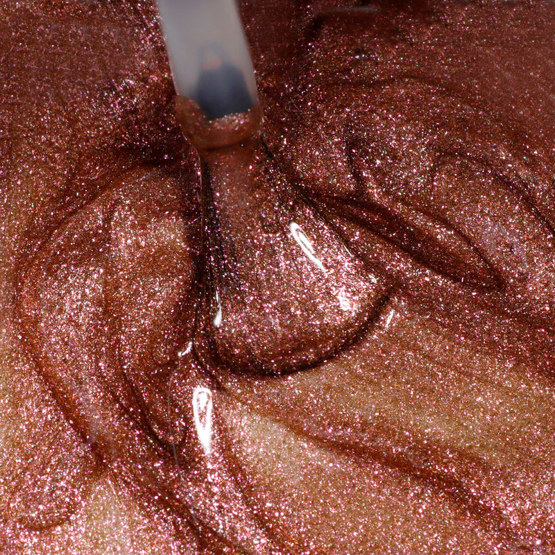 A close-up shows The Runway Edit by LONDONTOWN, a brush applying shimmery, metallic pink nail polish to create swirling patterns.