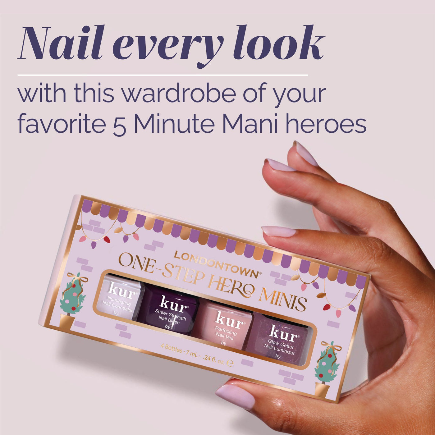 A hand with painted nails holds a LONDONTOWN One-Step Hero Minis box, featuring four mini nail polish bottles in assorted shades.