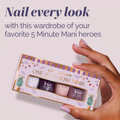 A hand with painted nails holds a LONDONTOWN One-Step Hero Minis box, featuring four mini nail polish bottles in assorted shades.