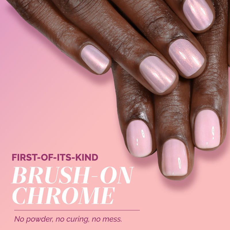 Close-up of hands with shiny, light pink glazed chrome nails. Text reads: "LONDONTOWN Modern Chromance Valentine’s Day Set—first-of-its-kind brush-on chrome. No powder, no curing, no mess—a true love story for your nails.