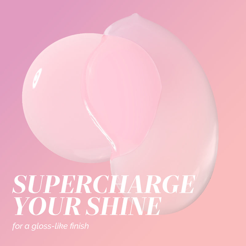 A translucent pink glazed gel bubble on a pink gradient background features the text "SUPERCHARGE YOUR SHINE for a gloss-like finish" in white, highlighting the Modern Chromance Valentine’s Day Set by LONDONTOWN.