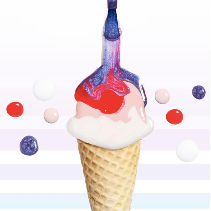 Strawberry Milk by LONDONTOWN is being painted with a blue brush; colorful round candies surround the sweet cone with swirled white, red, and pink ice cream.