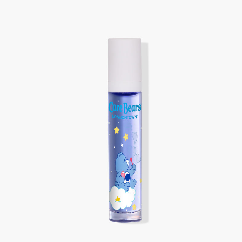 The LONDONTOWN Roll & Glow Cuticle Oil - Cotton Candy Cloud comes in a blue, cylindrical, pocket-sized bottle with a white cap and Care Bears graphics showing a bear on a cloud with stars and hearts.