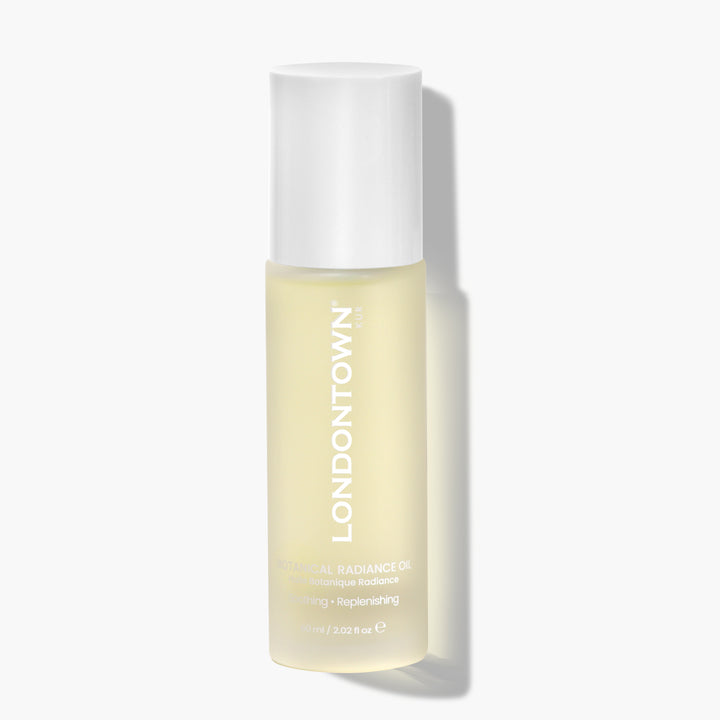 A 59 ml (2 oz) bottle of LONDONTOWN Botanical Radiance Oil with a white cap is shown on a white background—ideal for daily hydration and brightening.