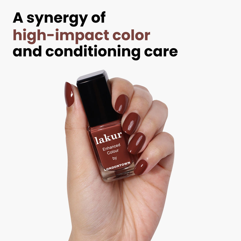 A hand holding a bottle of LONDONTOWN Oud Mood nail polish in rich, hot chocolate brown. Text reads: "A synergy of high-impact color and conditioning care.