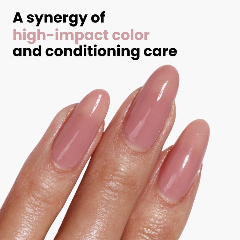 Close-up of manicured fingers with glossy pink nails against a white background. Text reads, "Crowning Crumpet by LONDONTOWN offers high-impact color and conditioning care, infused with Florium Complex for added nourishment.