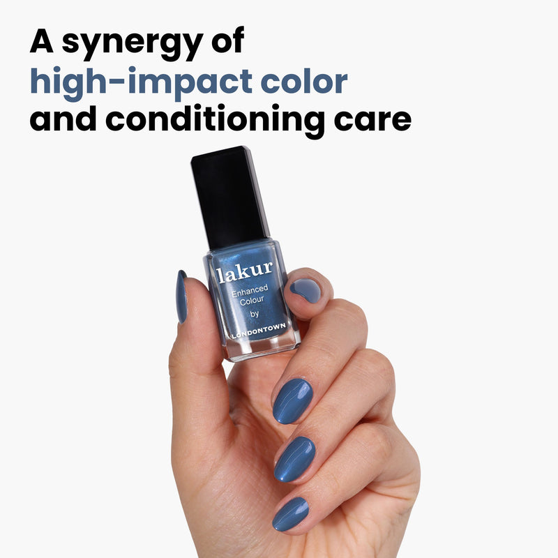 A hand showcases perfectly polished nails matching a "Blue Diamond" bottle of polish by LONDONTOWN, highlighting a synergy of vibrant color and nourishing care.