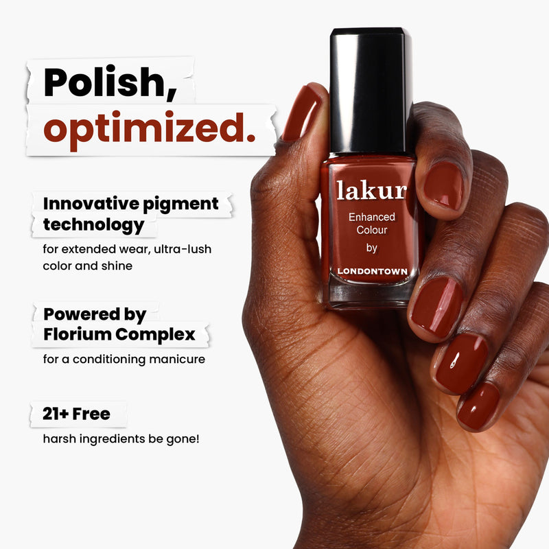 A hand holds LONDONTOWN's "You Autumn Know" nail polish, showcasing its rich, reddened umber hue with the innovative Florium Complex and a 21+ Free formula.