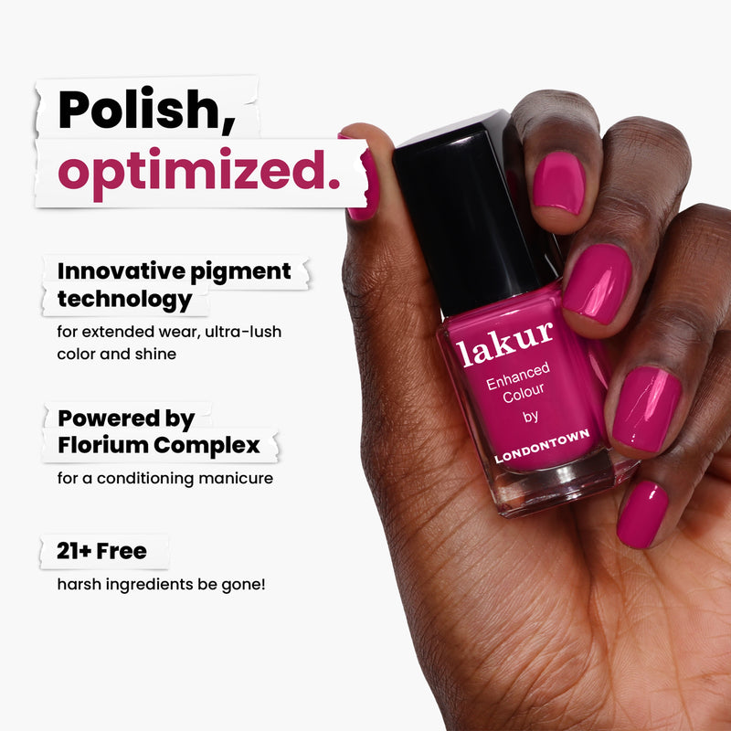 A hand holds LONDONTOWN's Teeny 'Kini pink nail polish, reminiscent of vibrant sangria. It features innovative pigment technology, powered by Florium Complex, and is 21+ free of harsh ingredients.