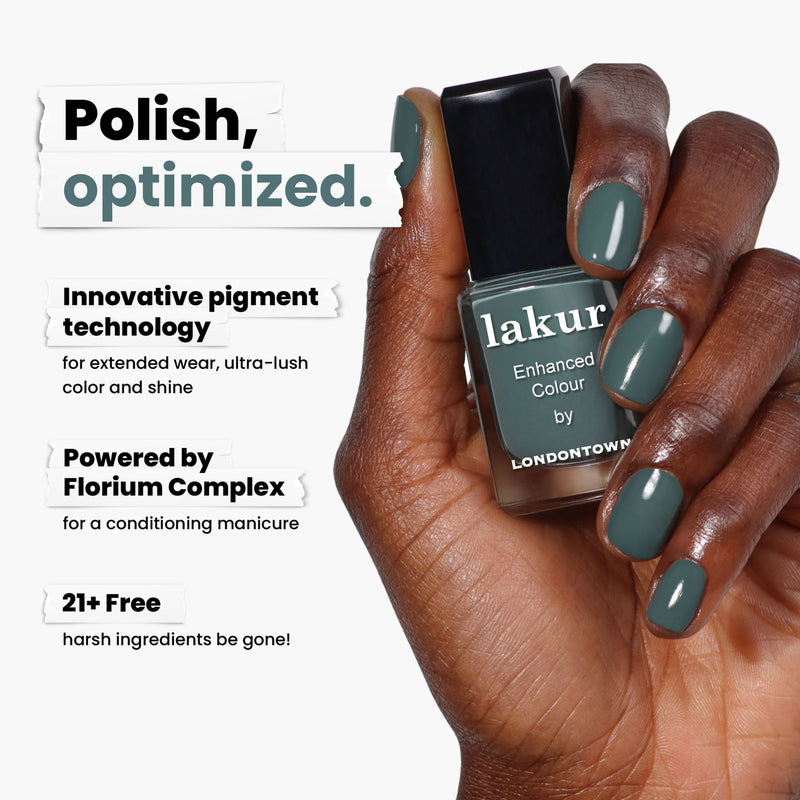 A hand holds a bottle of luxurious olive green LONDONTOWN nail polish labeled "Velvet Drapes," featuring innovative pigment technology with Florium Complex, and is 21+ free of harsh ingredients.