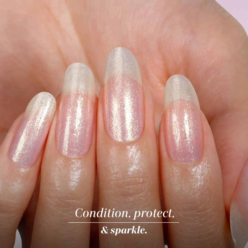 Close-up of a hand with four natural, medium-length nails painted with LONDONTOWN Shimmering Nail Highlighter in Sunkissed—a sheer, shimmery polish that conditions, protects, and adds sparkle.