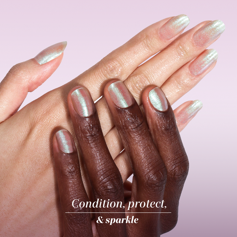 Two hands with LONDONTOWN Shimmering Nail Highlighter - Stardust, featuring iridescent shine, rest on each other against a light pink background. Below, the text reads: "Condition, protect, & sparkle.