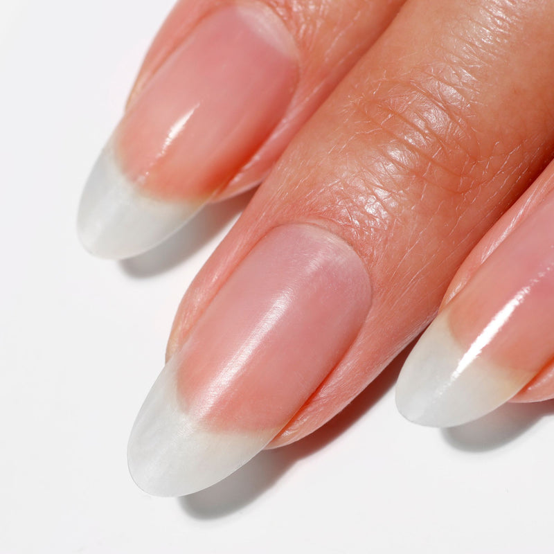 Close-up of three fingernails with a natural, clean, and slightly glossy look, achieved using LONDONTOWN Strengthening Nail Cream for healthy nail beds and well-maintained cuticles.