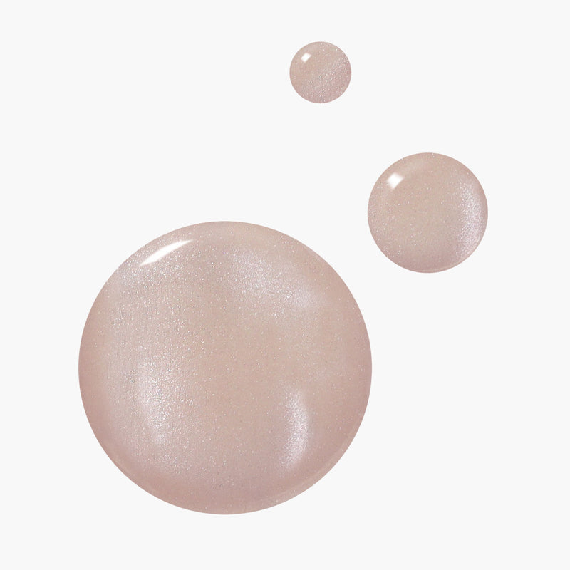 Three soft, translucent "Pearl" droplets by LONDONTOWN shimmer delicately like champagne bubbles against a plain white background.