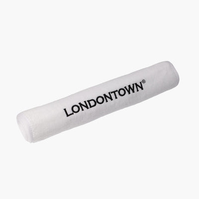 A white Londontown Towel rolled up, featuring the brand name "LONDONTOWN" in black capital letters on its side.