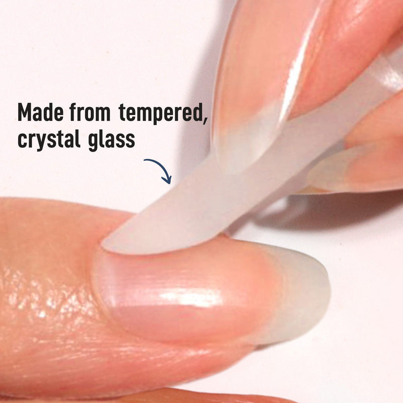 A close-up shows a LONDONTOWN Glass Cuticle Pusher gently refining a fingernail. Text reads: "Made from tempered, crystal glass.