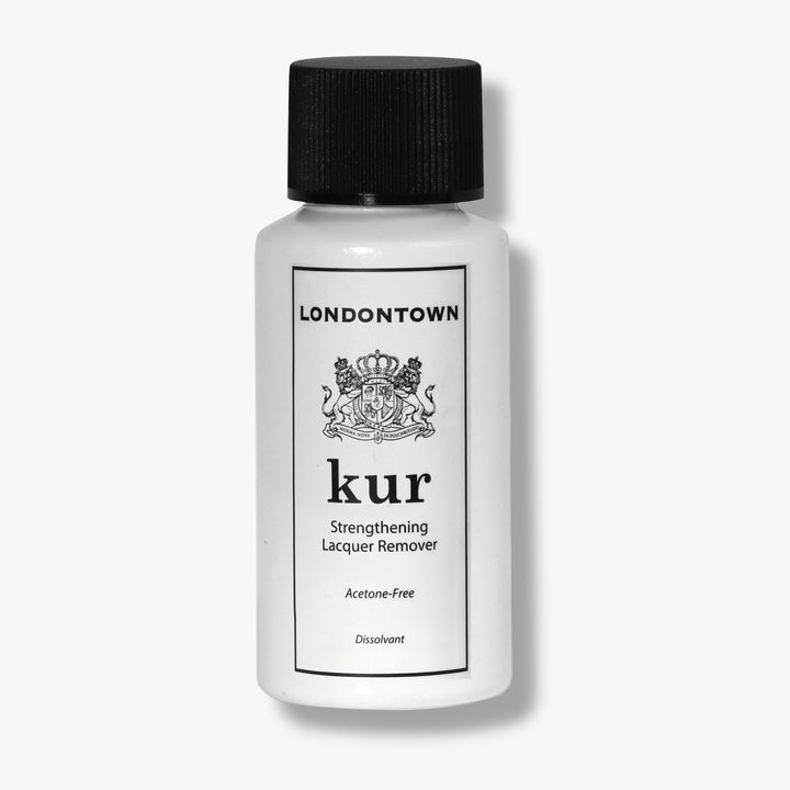 A white bottle labeled "LONDONTOWN Mini Strengthening Lacquer Remover" with a black screw cap is displayed against a plain background.