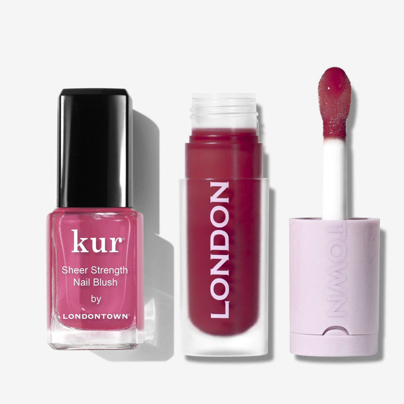 The Hibiscus Blush & Berry Glaze Duo from LONDONTOWN, featuring pink nail polish for a sheer glow and dark pink lip gloss for vibrant lips, is displayed against a white background.