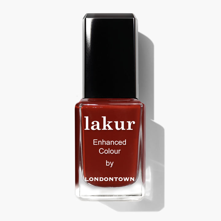 A bottle of "You Autumn Know" Lakur Enhanced Colour nail polish by LONDONTOWN in a rich, reddened umber shade, featuring a black cap against a white background.