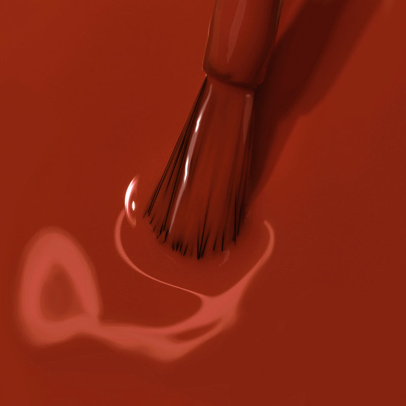 Close-up of a paintbrush dipped in LONDONTOWN's You Autumn Know paint, with a swirl of rich, reddened umber visible around the bristles.