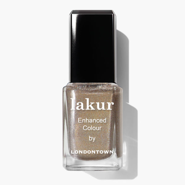 A bottle of LONDONTOWN You're Golden Lakur nail polish in holographic gold with a black cap, shown on a white background.