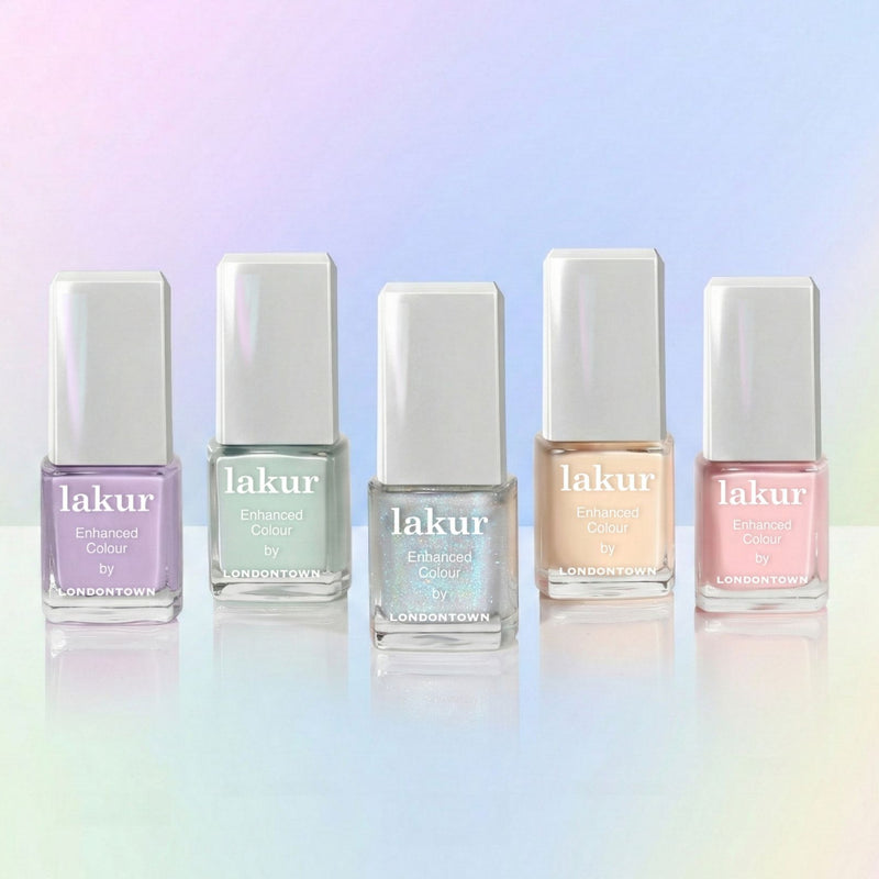 The Beary Polished Mini Set by LONDONTOWN features five pastel nail polishes inspired by Care Bears, arranged in a row against a soft gradient backdrop—an adorable addition to any Care-A-Lot minis collection.