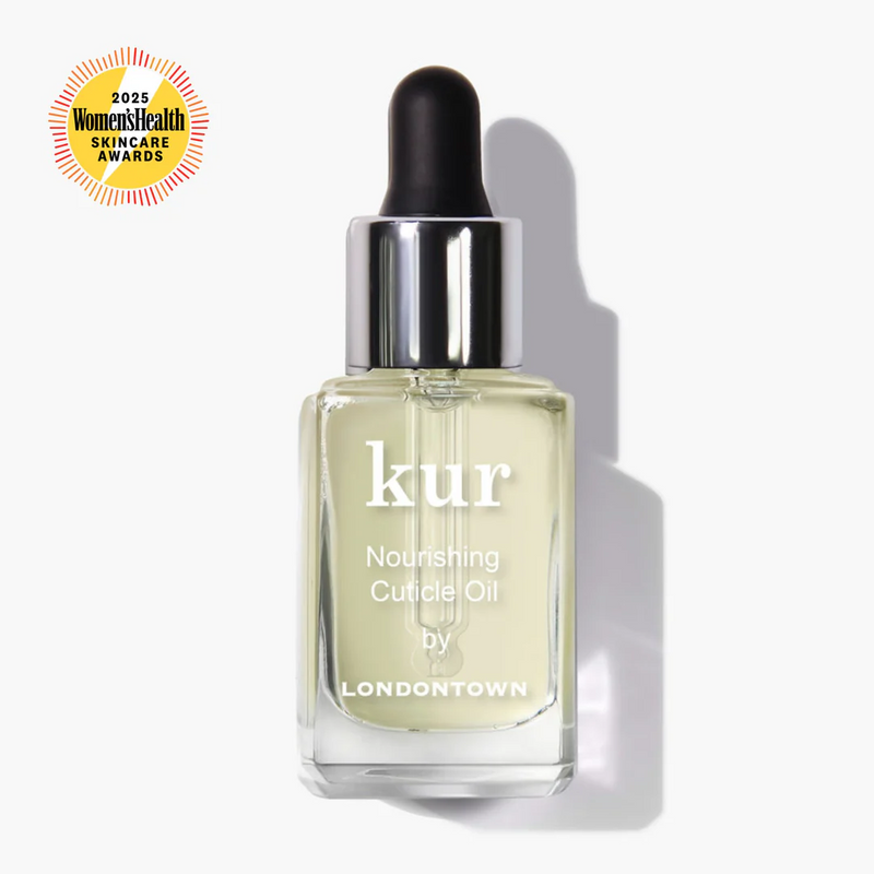 A bottle of LONDONTOWN Nourishing Cuticle Oil with a dropper cap, an essential treatment designed for optimal cuticle care. A 2025 Women’s Health Skincare Awards badge appears in the upper left corner.