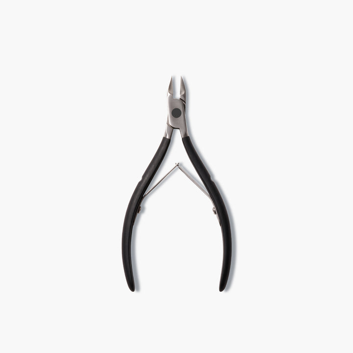 The LONDONTOWN Cuticle Nippers - Black, a pair of salon-grade metal cutters with black handles, is displayed on a white background.
