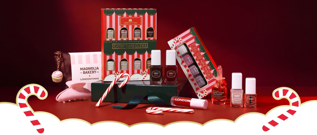 Holiday gift spread on a red backdrop with a white cloud band and candy canes