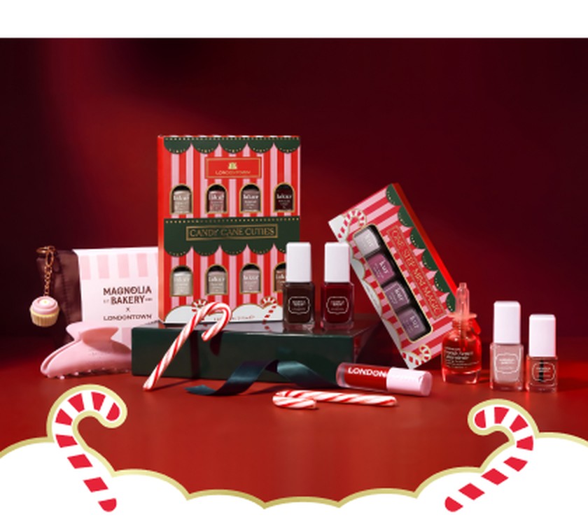 Holiday gift spread on a red backdrop with a white cloud band and candy canes