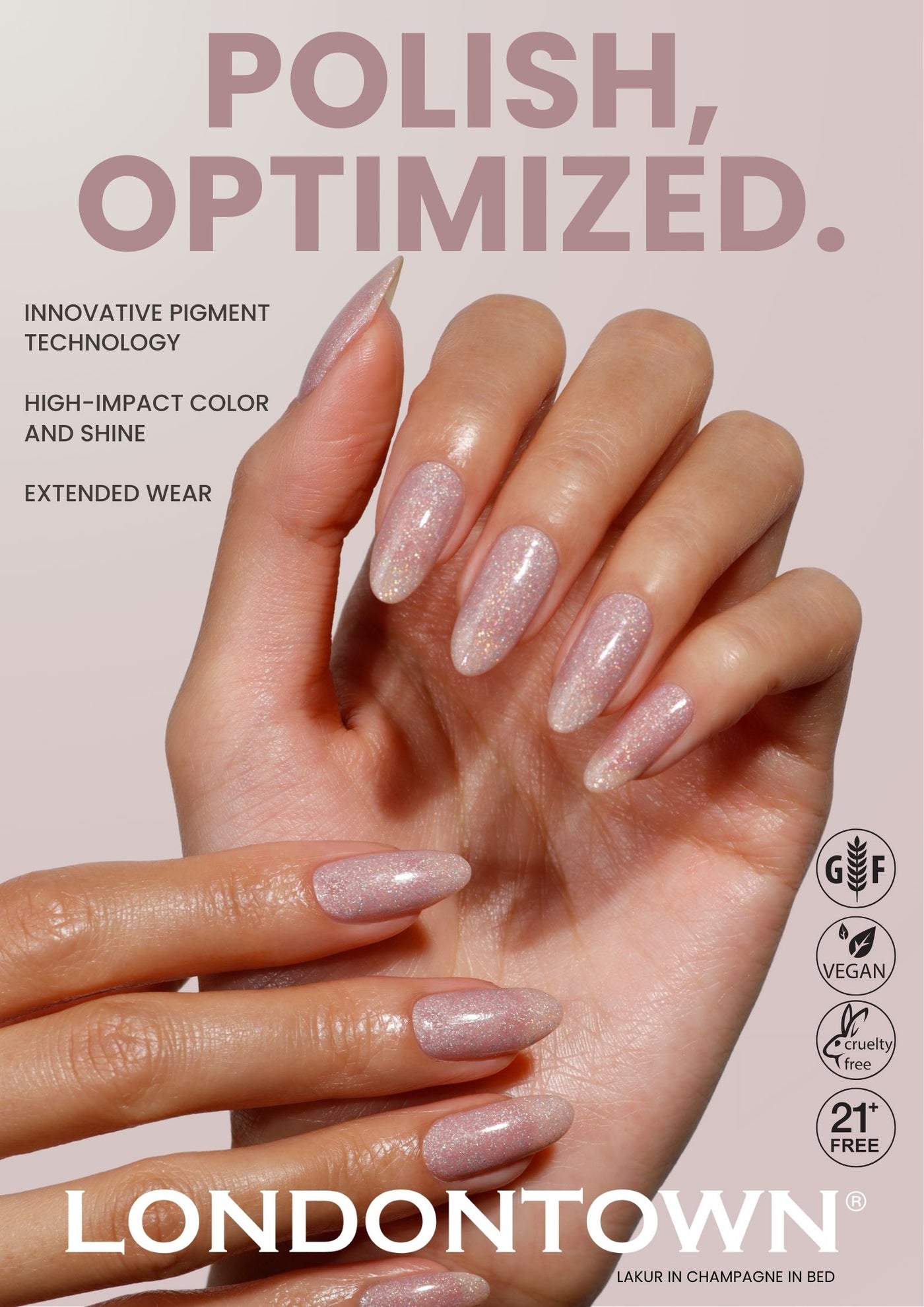 A hand with long, almond-shaped nails painted in shimmery pale pink polish is shown, with product claims and the LONDONTOWN brand featured in the background. Product: Londontown Poster #5.