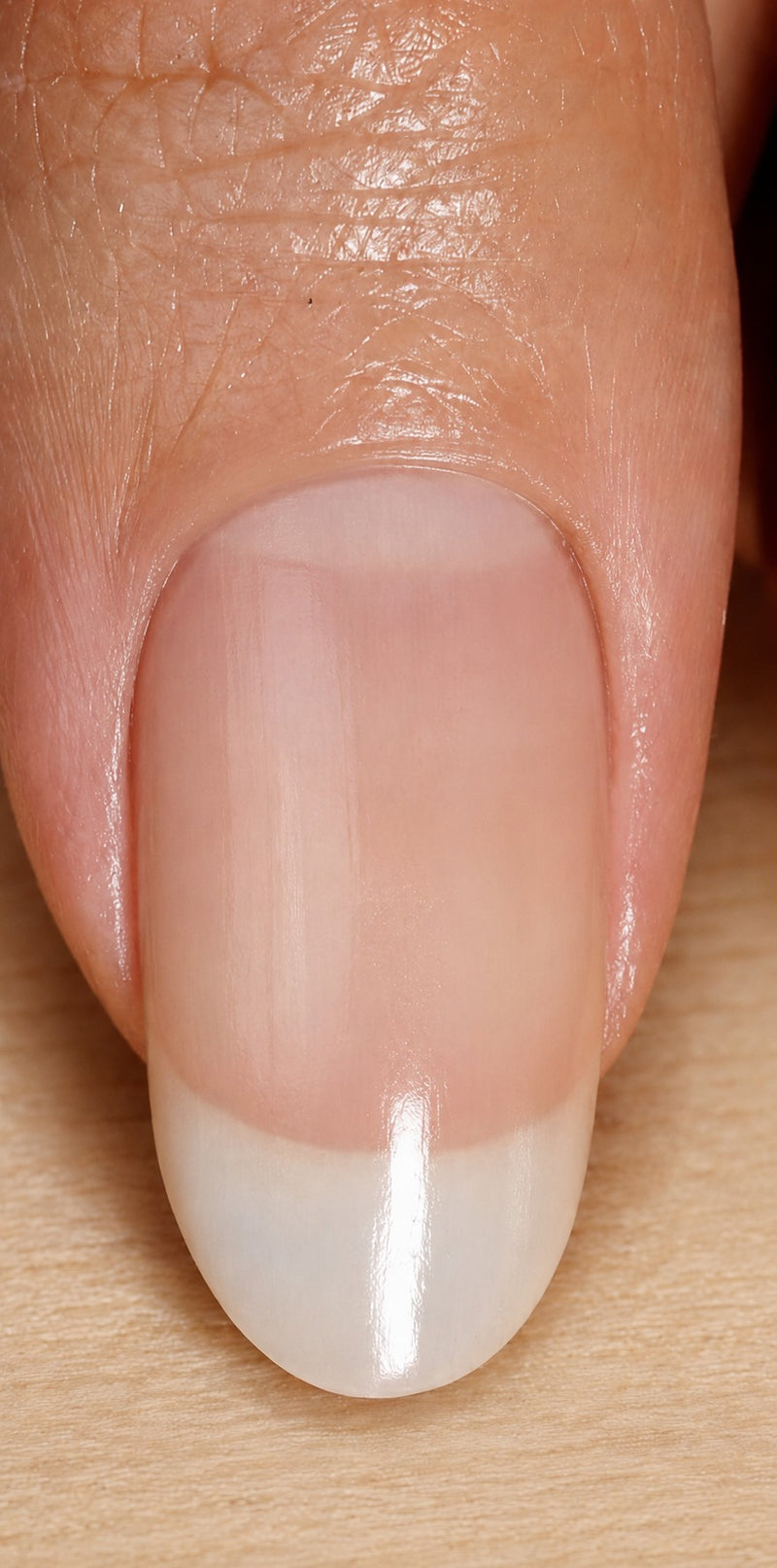 Close-up of a hydrated, stronger-looking natural nail after treatment