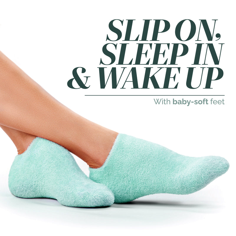 A person wears light blue fuzzy socks, lying on their side with legs extended by text promoting soft feet and cozy comfort—Pedi Perfect Moisturizing Spa Socks by LONDONTOWN.