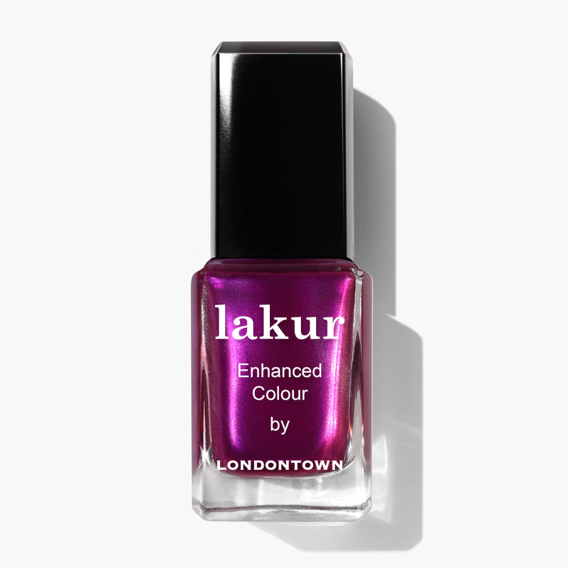 Bottle of LONDONTOWN's Alexa, Let's Dance! nail polish in a shimmering crushed grape shade with a black cap and white text.