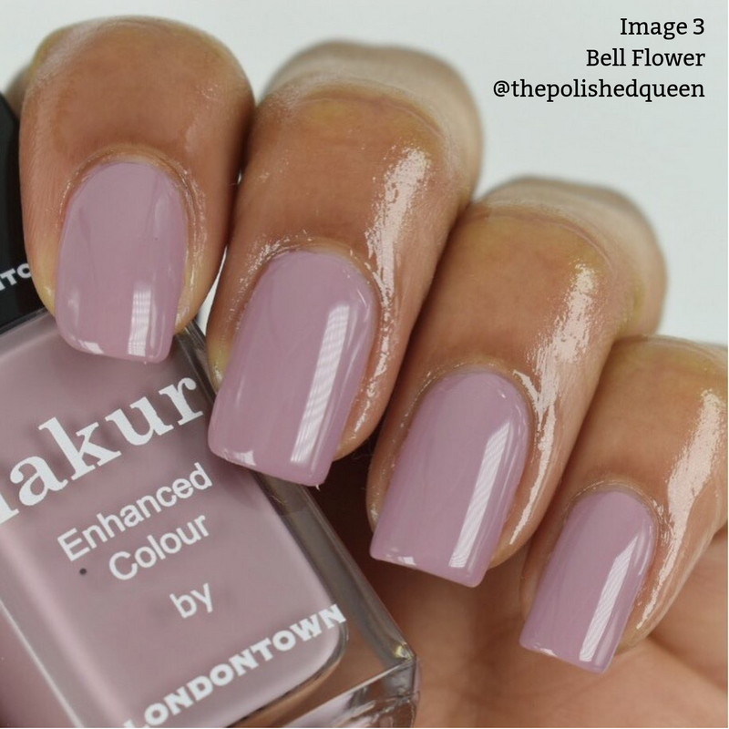 A hand with neatly manicured nails is painted in a romantic dusty pink, reminiscent of an English countryside bloom. The nail polish bottle is labeled "LONDONTOWN Bell Flower." Text: "Image 3 Bell Flower @thepolishedqueen.