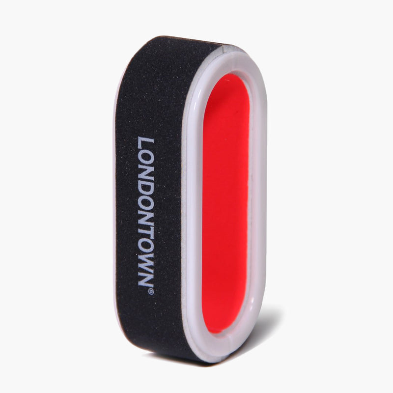 The LONDONTOWN Nail Buffer, featuring a black and white exterior with a red center and the brand name "LONDONTOWN" printed on its side, is a versatile tool that allows you to effortlessly file and shine your nails for a salon-worthy manicure.