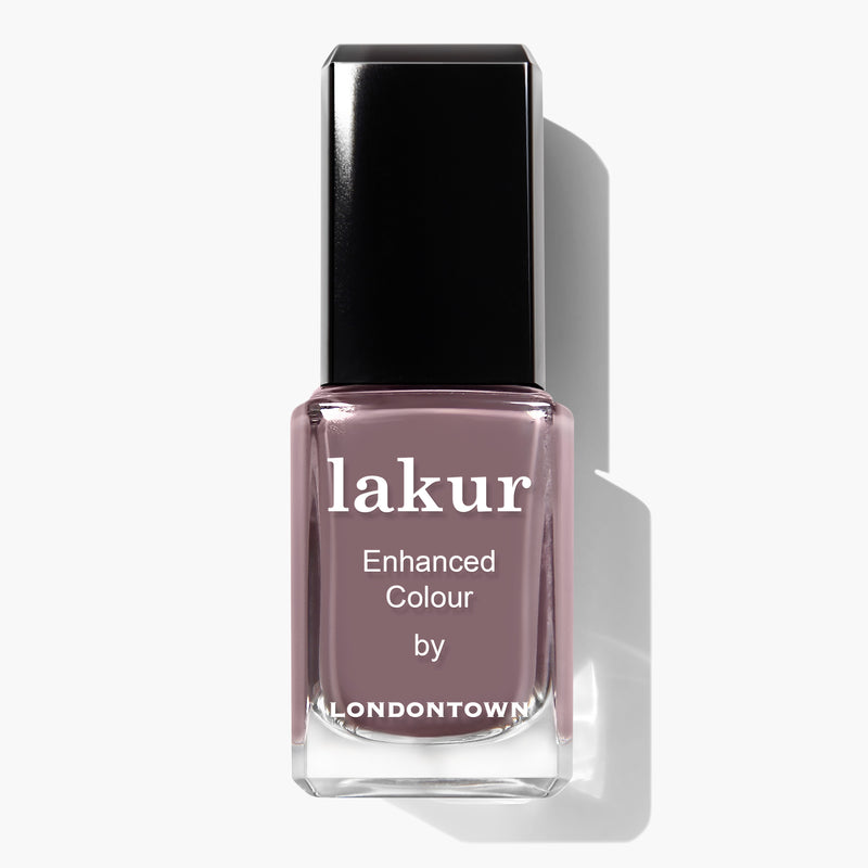 A bottle of LONDONTOWN's Lakur nail polish in the muted mauve shade called "Cashmere". The label reads "lakur Enhanced Colour by LONDONTOWN." This vegan, cruelty-free formula ensures a vibrant and lasting finish without sacrificing ethics.