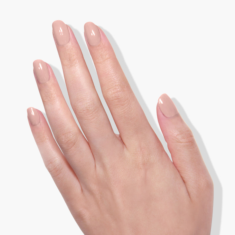 A hand with neatly manicured nails, painted in LONDONTOWN's Chiffon shade, is shown against a white background.
