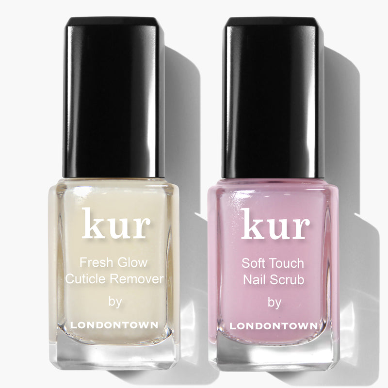 This tidy duo from LONDONTOWN, known as the Clean Up Cuticles Set, features two square bottles with black caps and white labels: Fresh Glow Cuticle Remover and Soft Touch Nail Scrub.